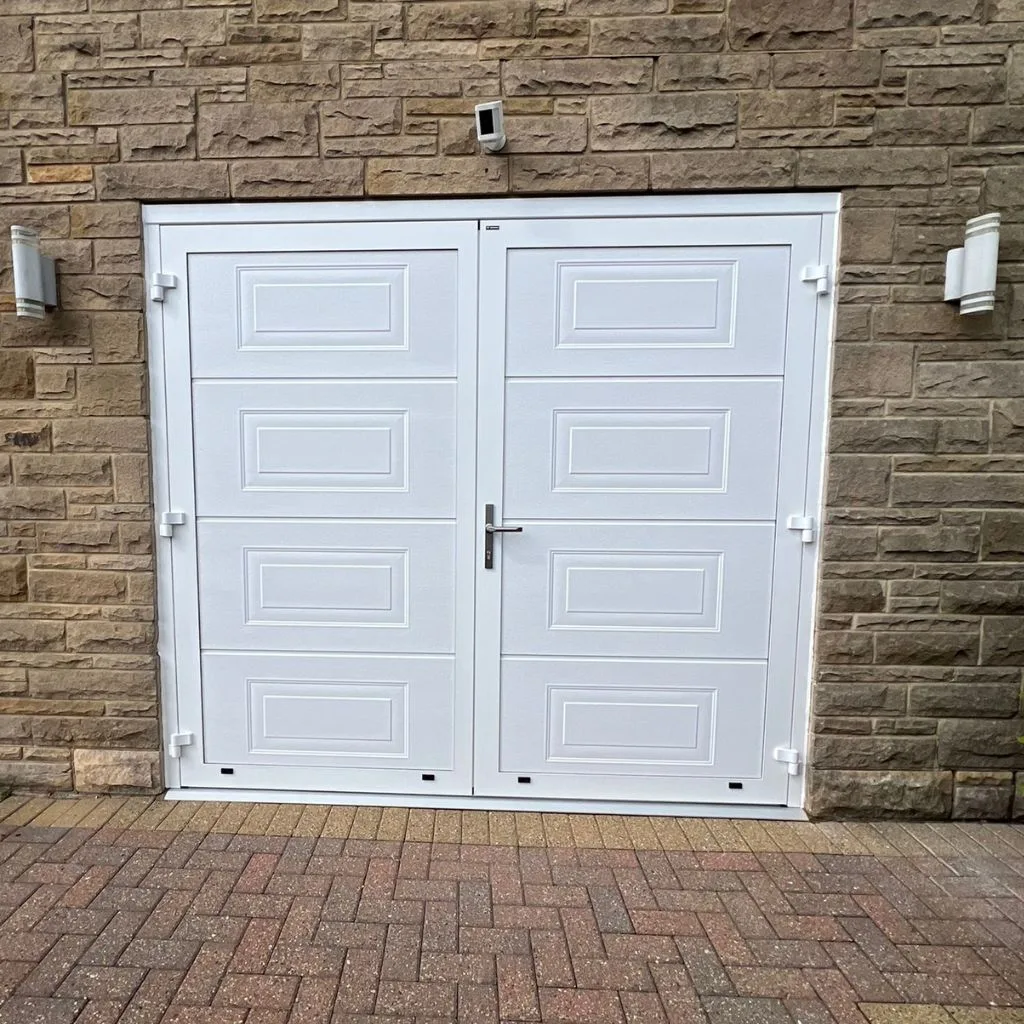traditional side hinged garage door in white with georgian panels, installed in whitby